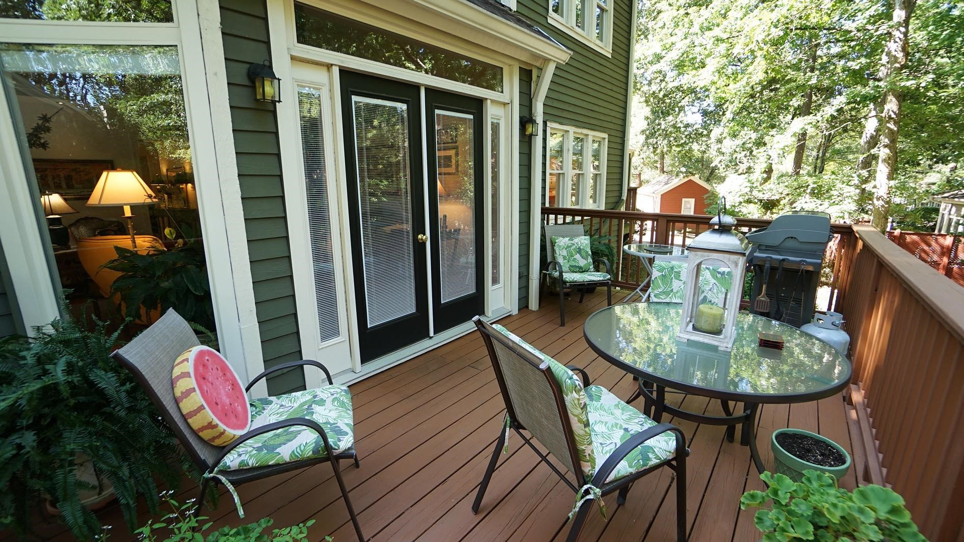 1809 Falls Church Road Raleigh, NC 27609 - Photo 47 of 56 a backyard of a house with barbeque oven table and chairs