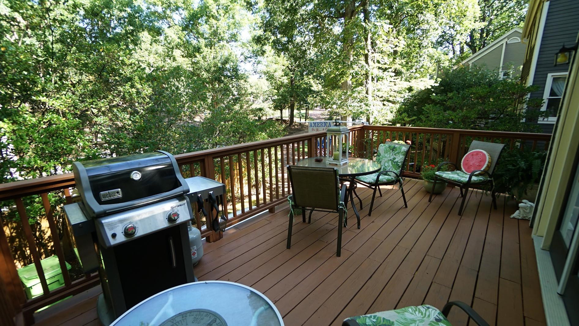 1809 Falls Church Road Raleigh, NC 27609 - Photo 50 of 56 a view of a chairs and table on the deck
