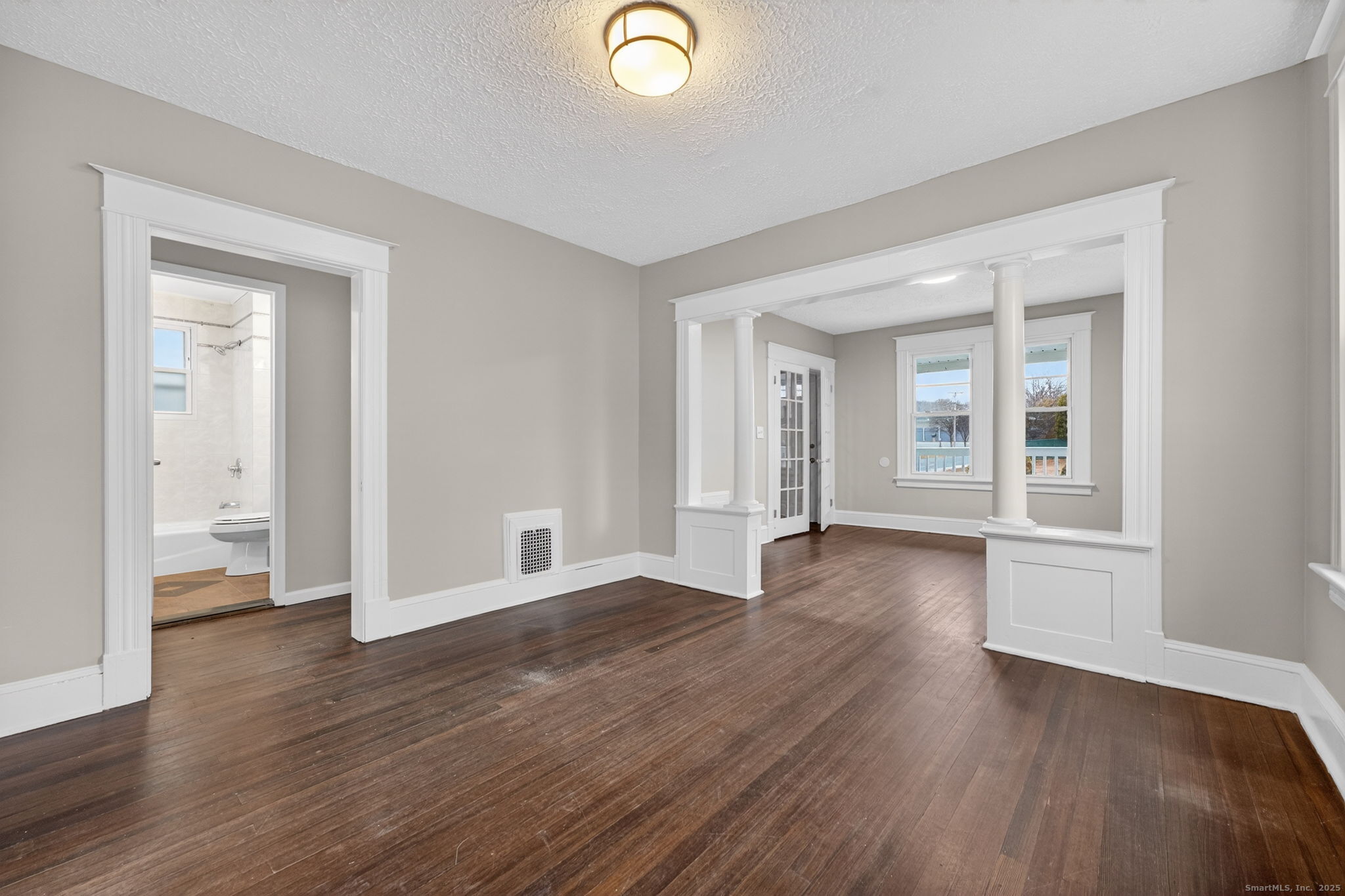 38 Center Street Bristol, CT 06010 - Photo 11 of 28 a view of livingroom with hardwood floor and window