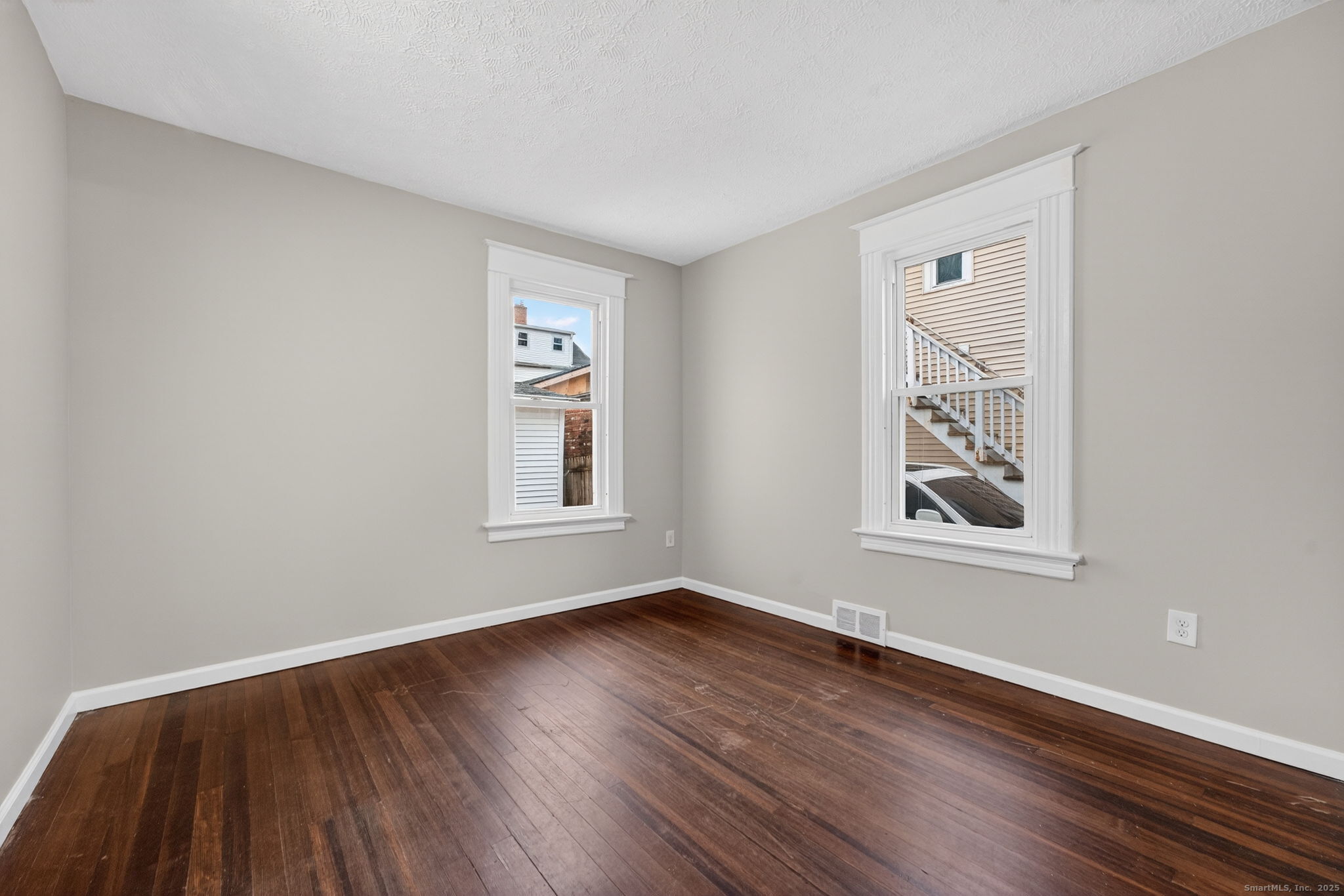 38 Center Street Bristol, CT 06010 - Photo 13 of 28 a view of an empty room with wooden floor and a window
