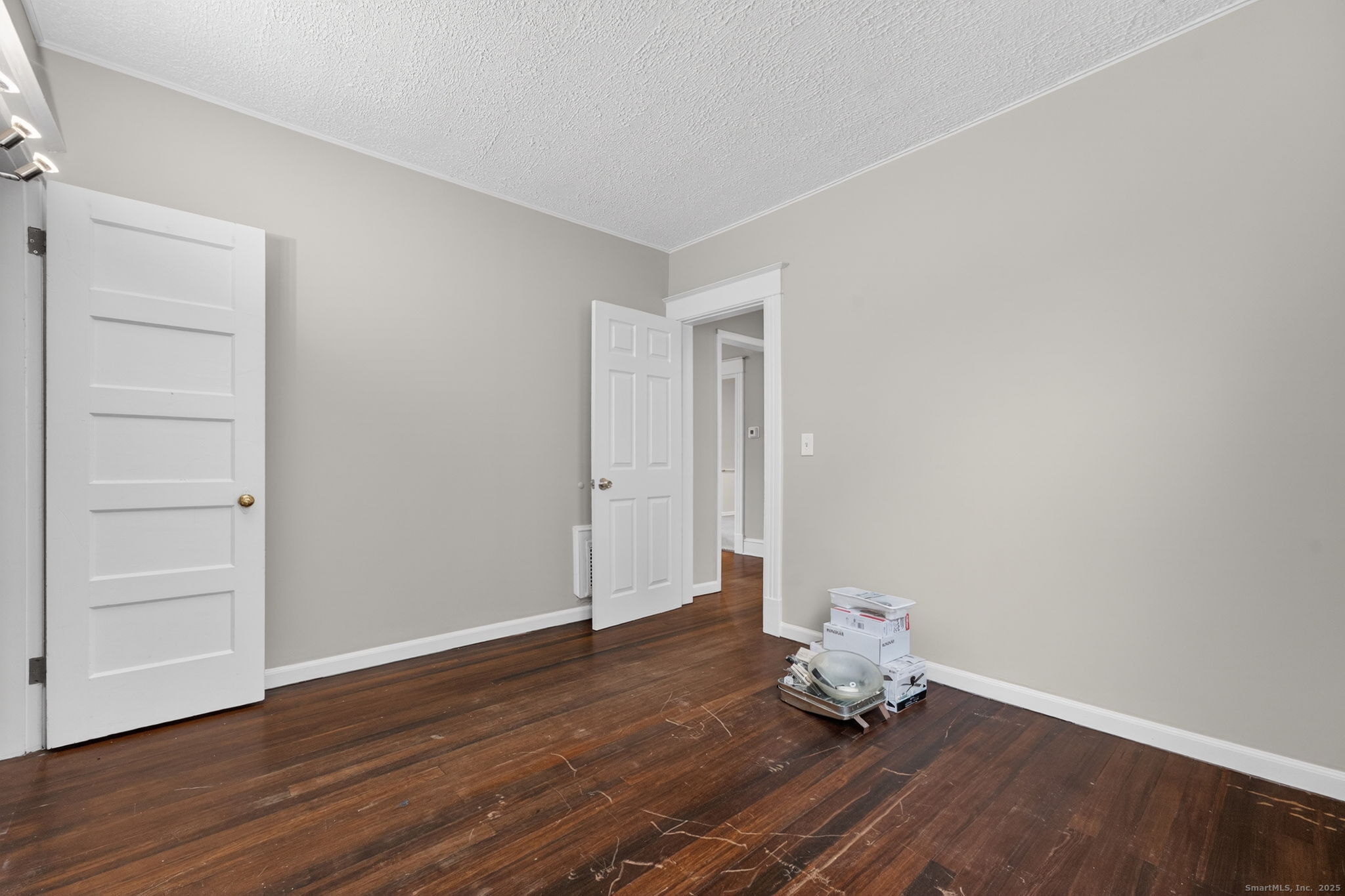 38 Center Street Bristol, CT 06010 - Photo 15 of 28 a room with wooden floor and closet