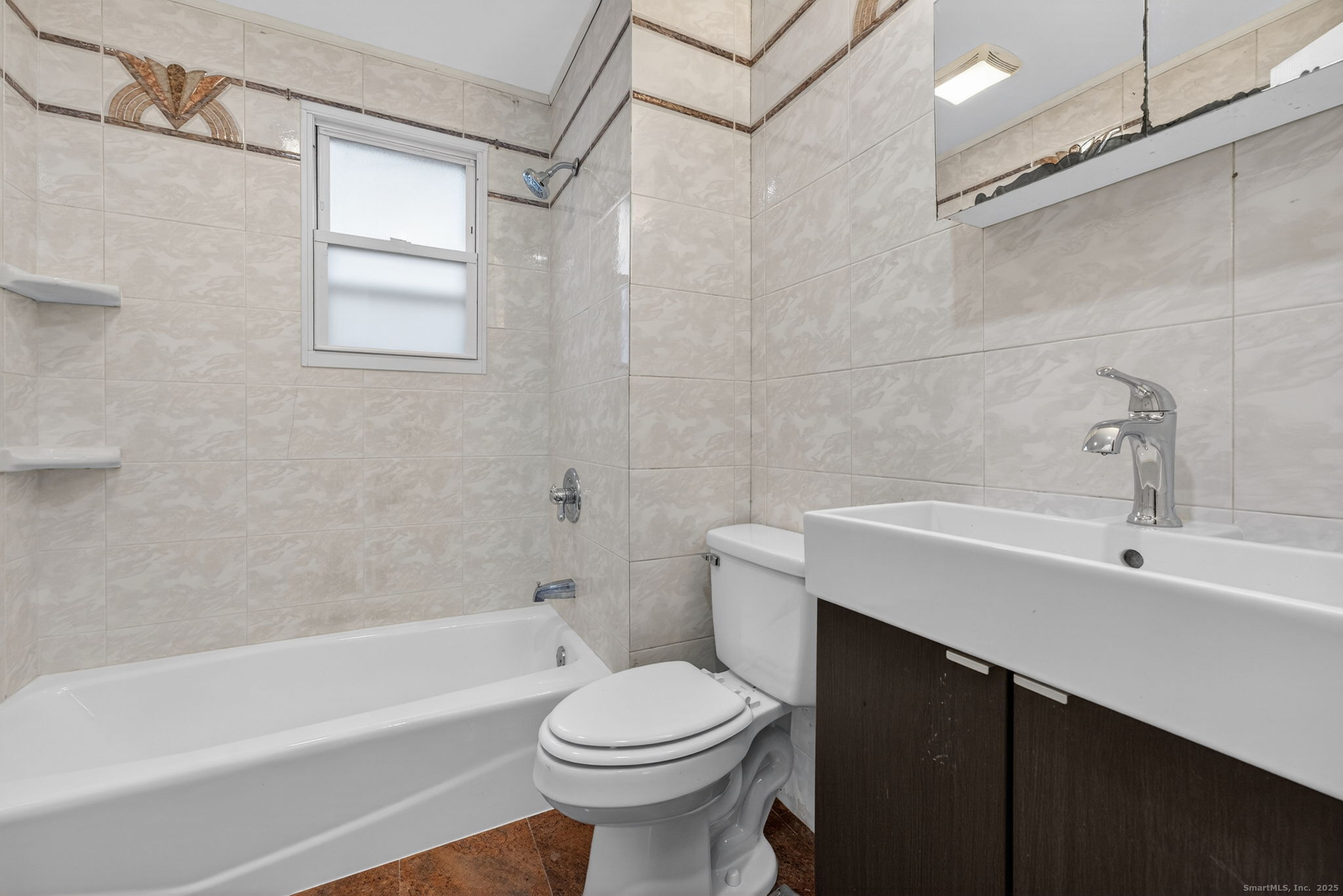 38 Center Street Bristol, CT 06010 - Photo 16 of 28 a bathroom with a sink a toilet and a bathtub