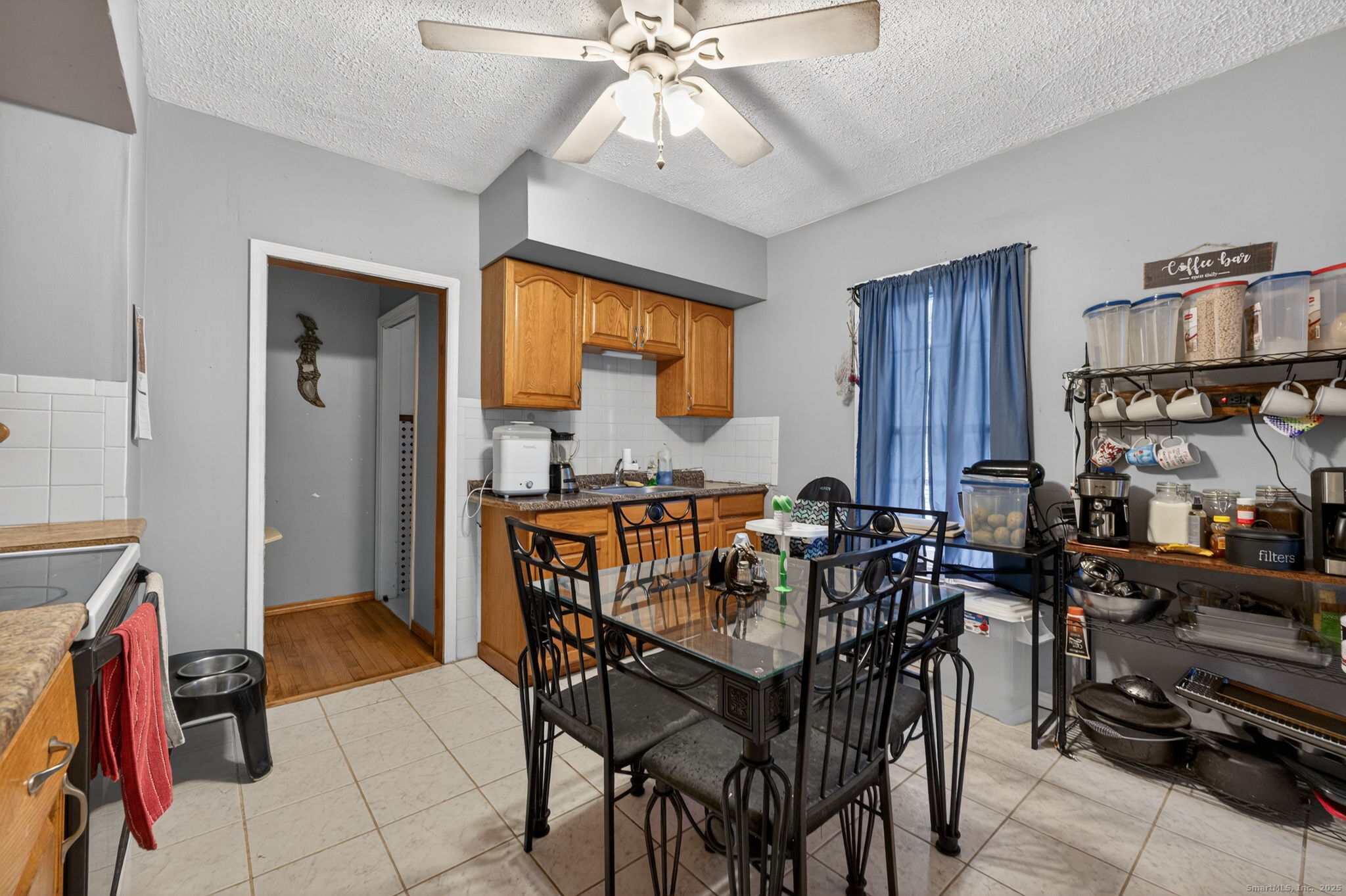 38 Center Street Bristol, CT 06010 - Photo 17 of 28 a view of a dining room with furniture and a chandelier