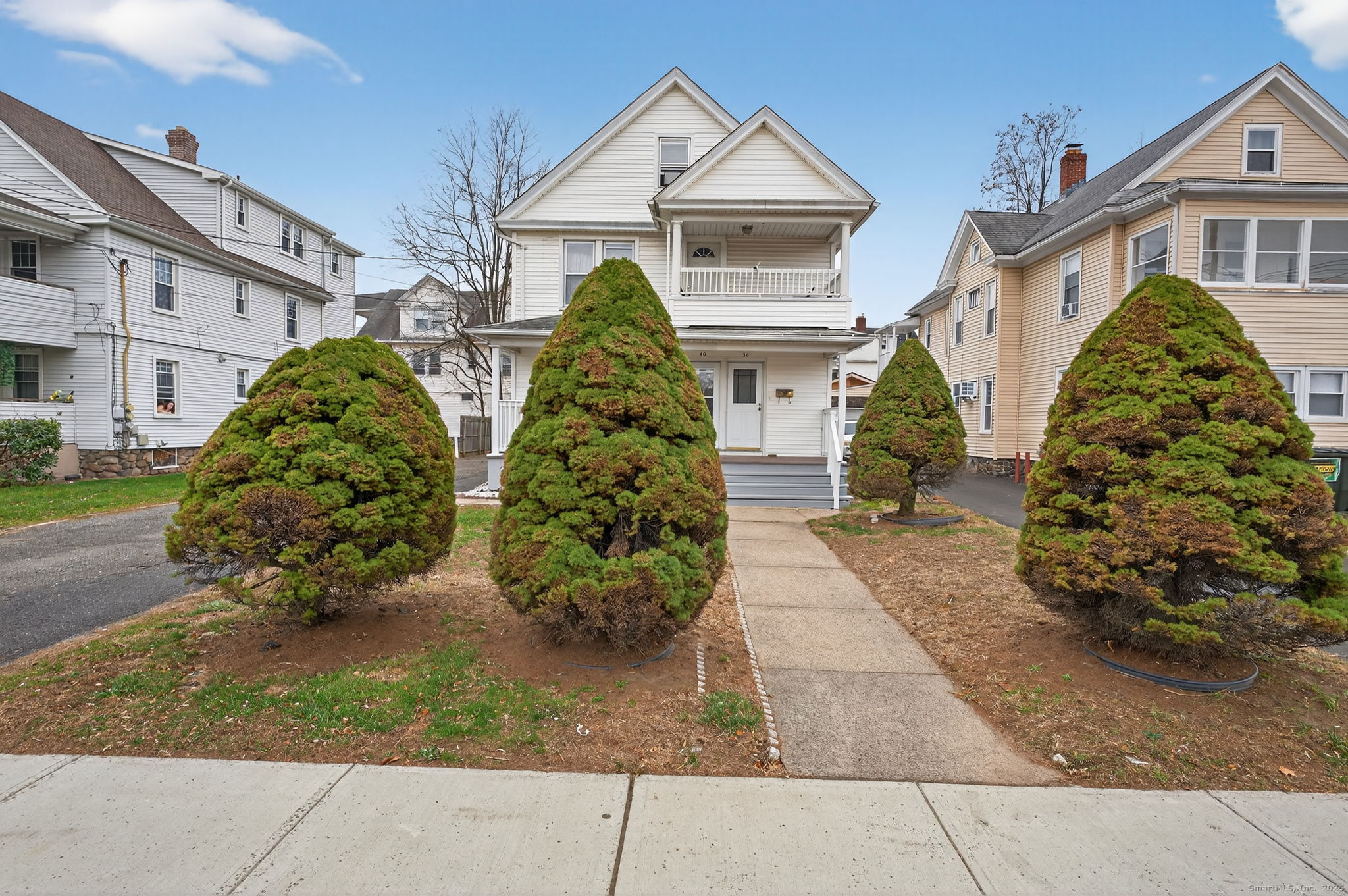 38 Center Street Bristol, CT 06010 - Photo 2 of 28 a front view of a house with garden