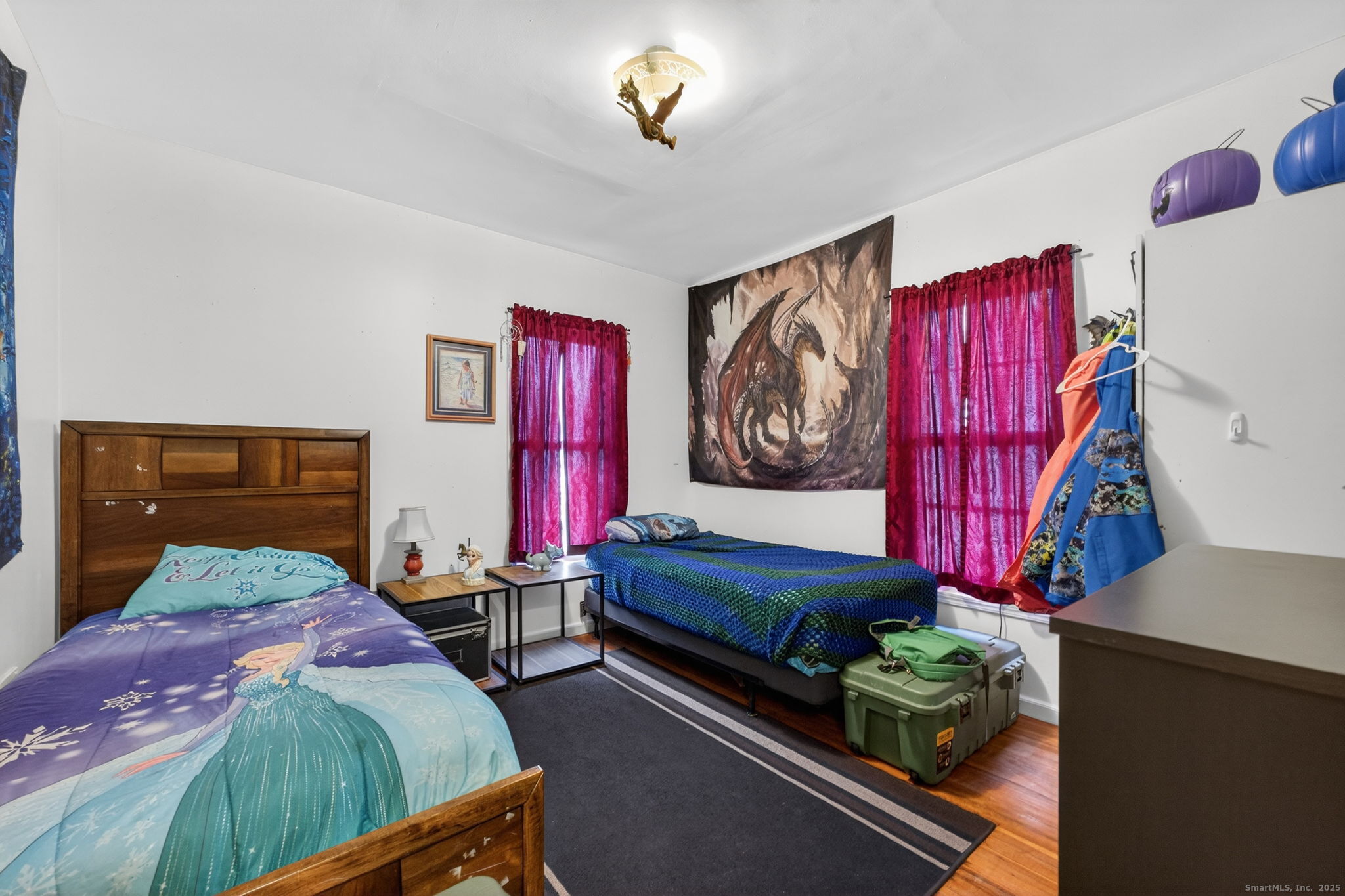 38 Center Street Bristol, CT 06010 - Photo 26 of 28 a bedroom with bed and a chandelier