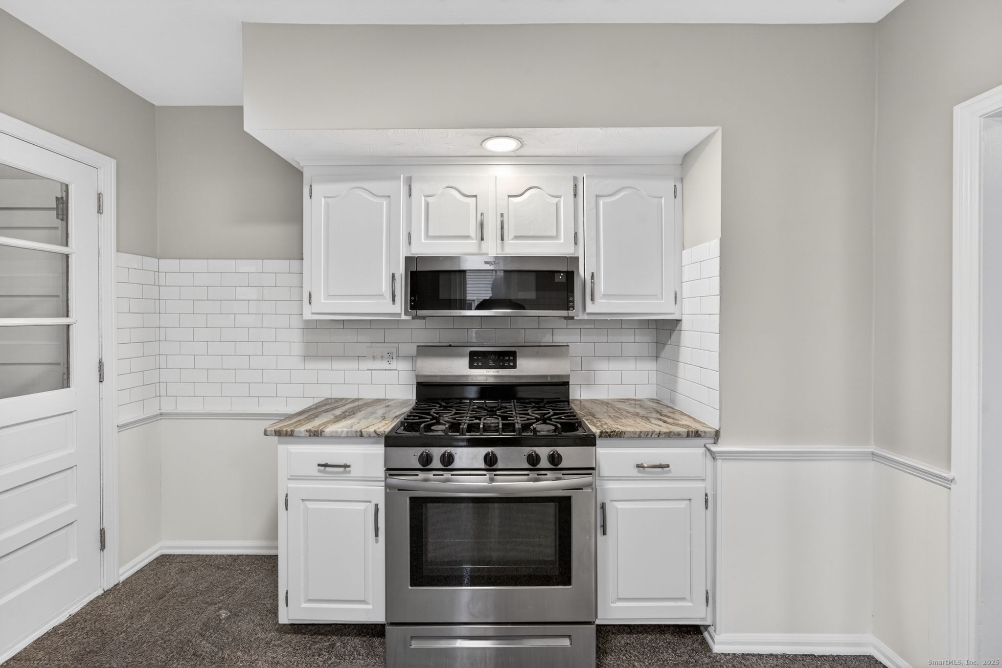 38 Center Street Bristol, CT 06010 - Photo 3 of 28 a kitchen with cabinets and steel appliances
