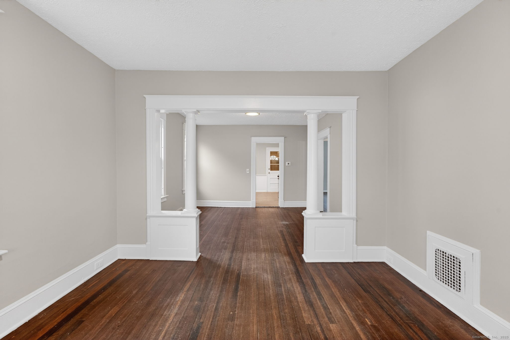 38 Center Street Bristol, CT 06010 - Photo 8 of 28 a view of an empty room with wooden floor and a window