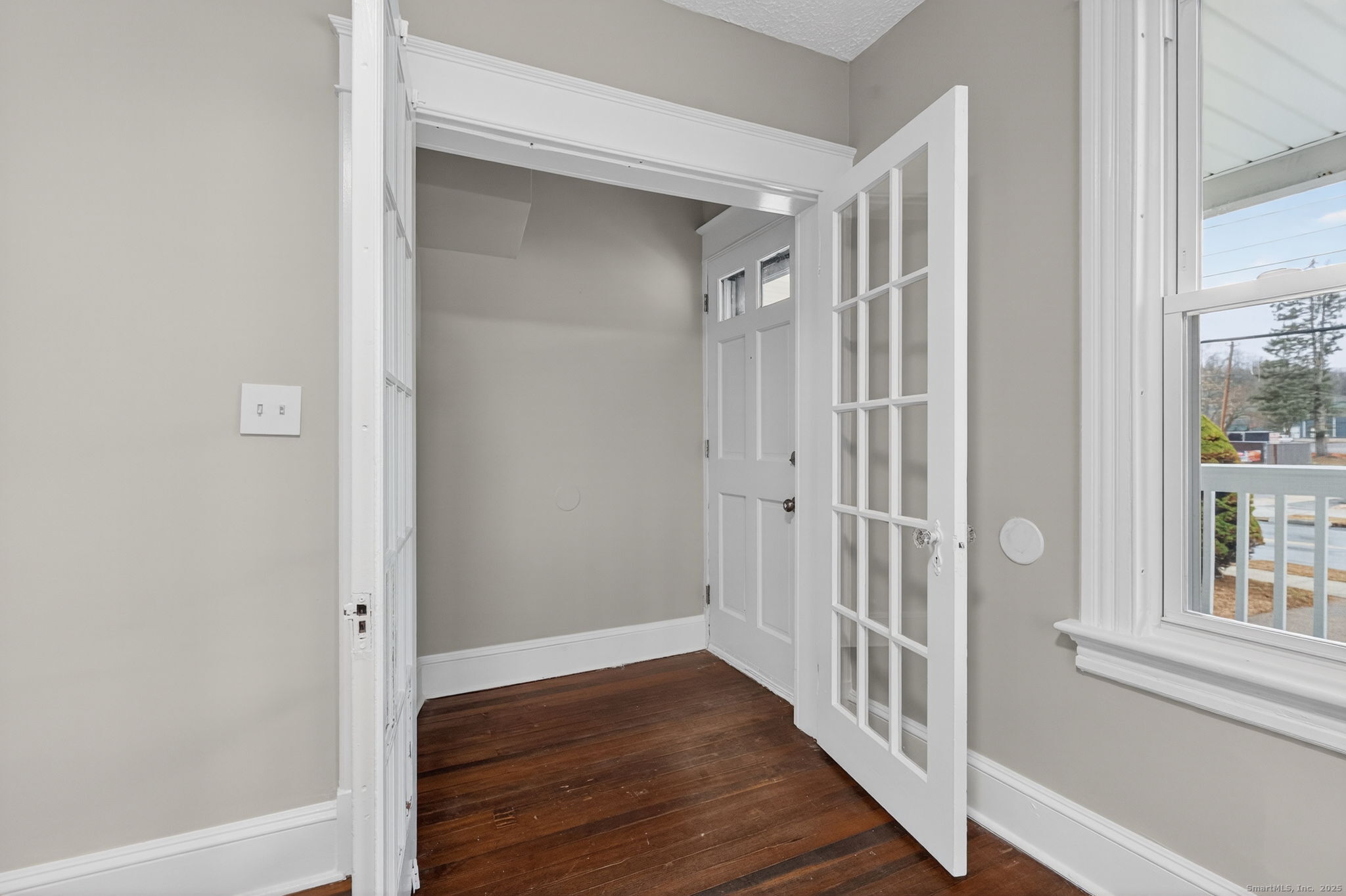 38 Center Street Bristol, CT 06010 - Photo 10 of 28 a view of a hallway with wooden floor