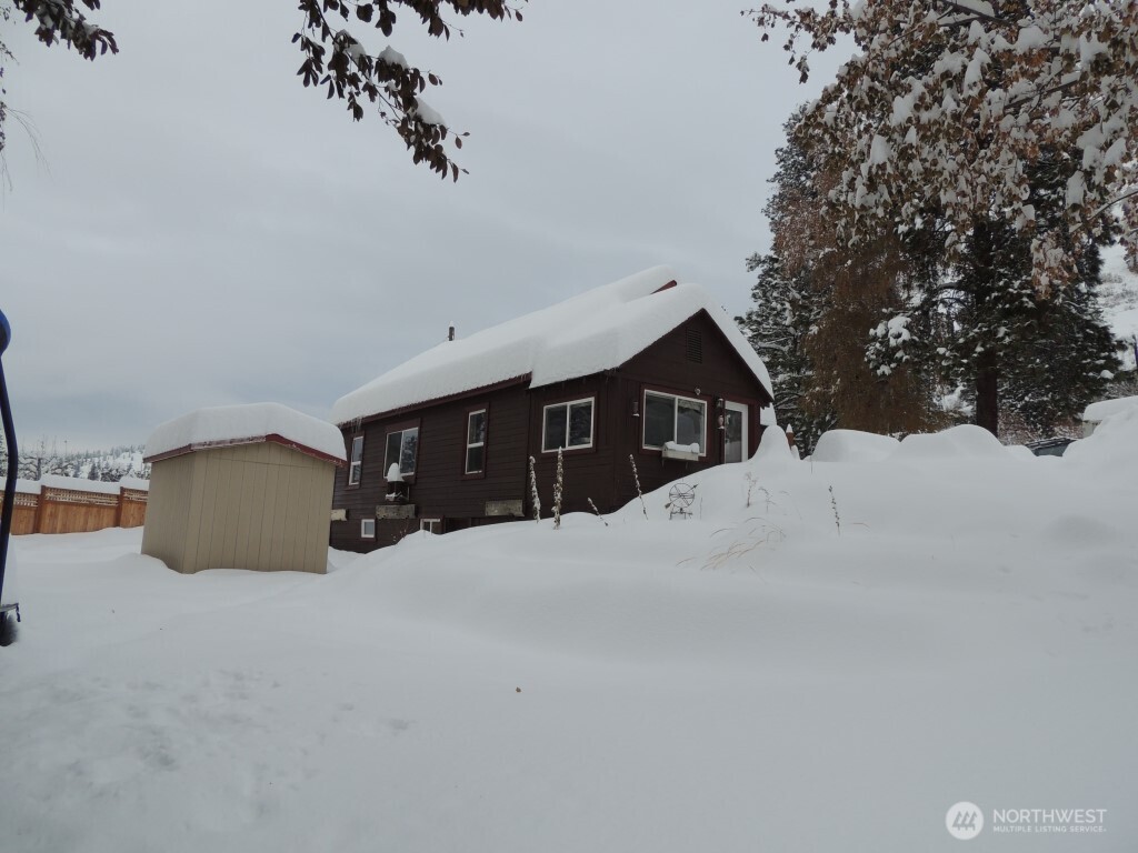 9291 Pakascwa Road Peshastin, WA 98847 - Photo 16 of 38 a view of a house with a snow in the yard
