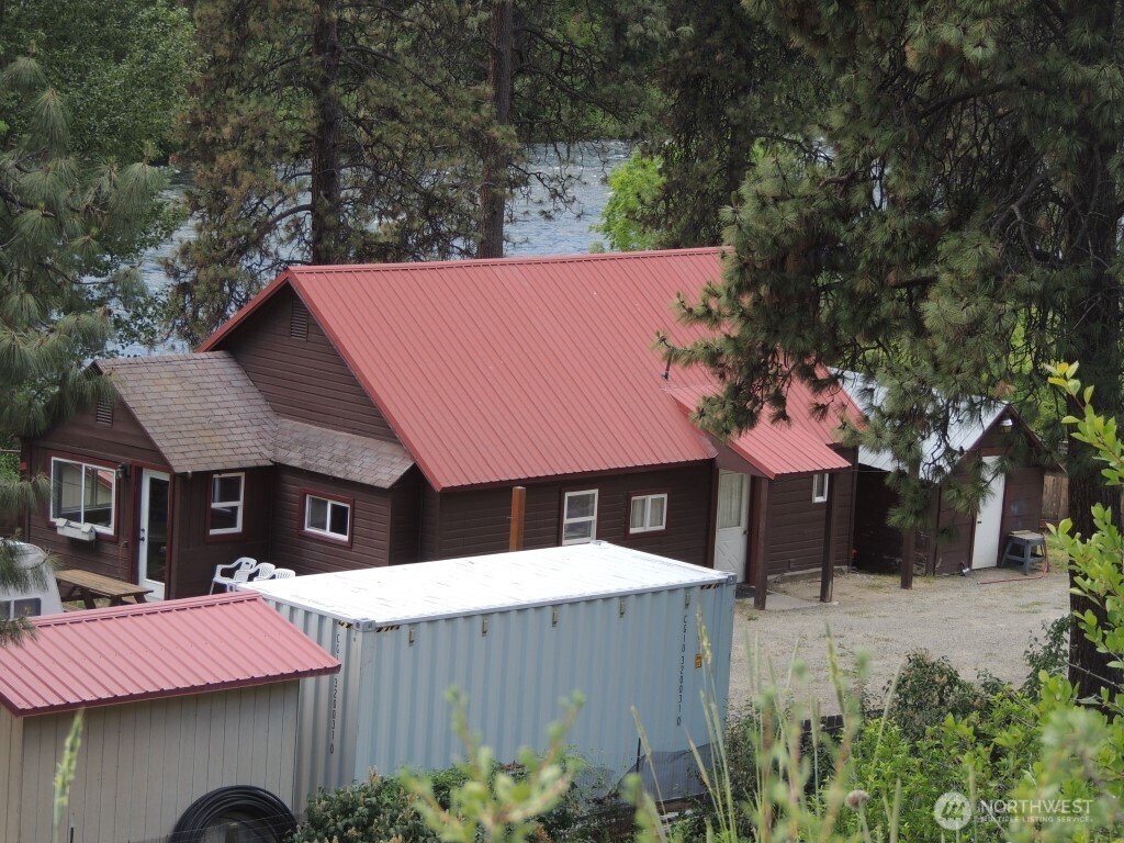 9291 Pakascwa Road Peshastin, WA 98847 - Photo 37 of 38 a front view of a house with a yard and tree s