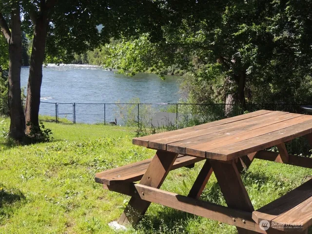 a view of backyard with seating space