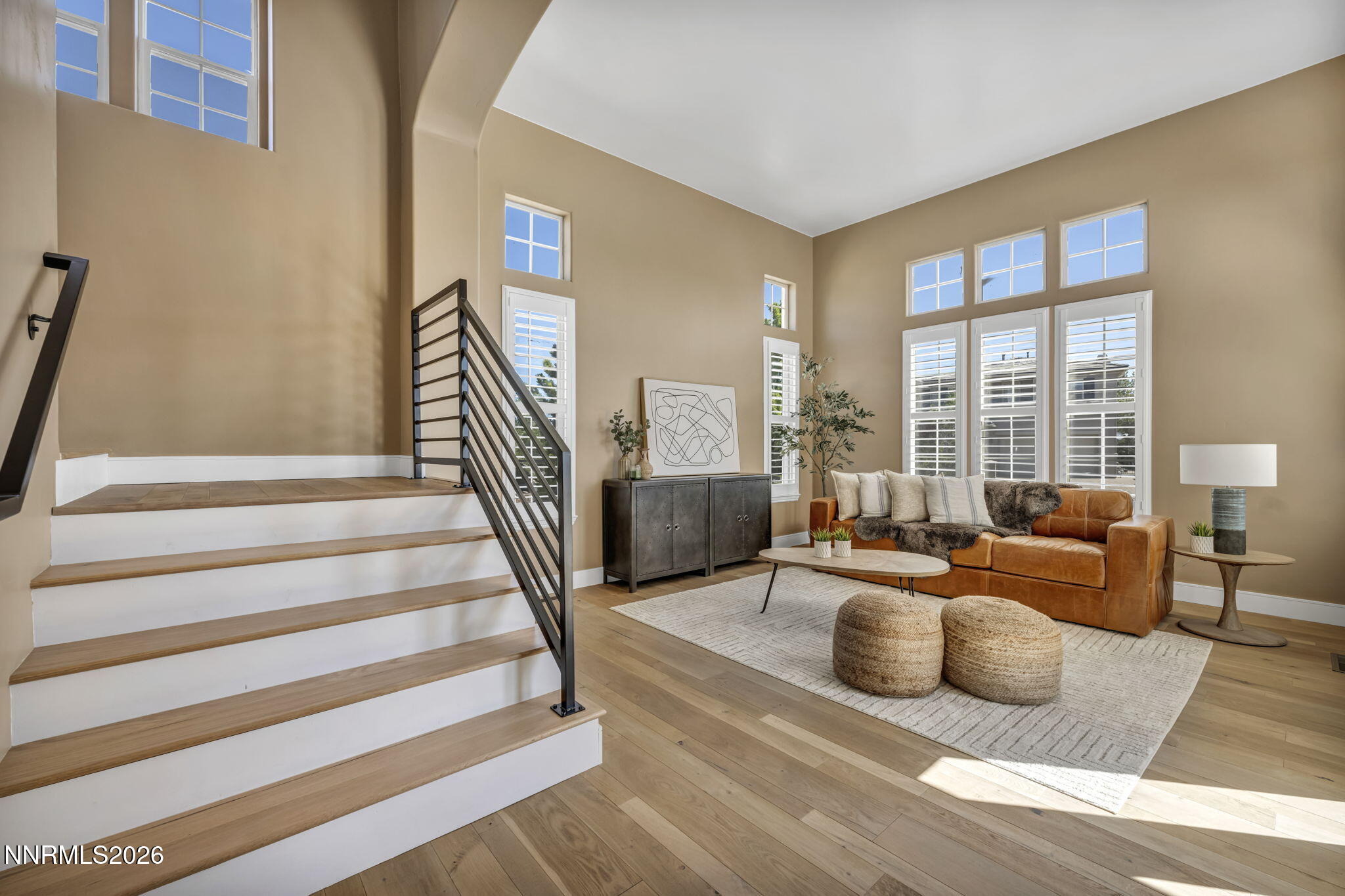 2965 Roundrock Court Reno, NV 89511 - Photo 18 of 40 a living room with furniture and a floor to ceiling window