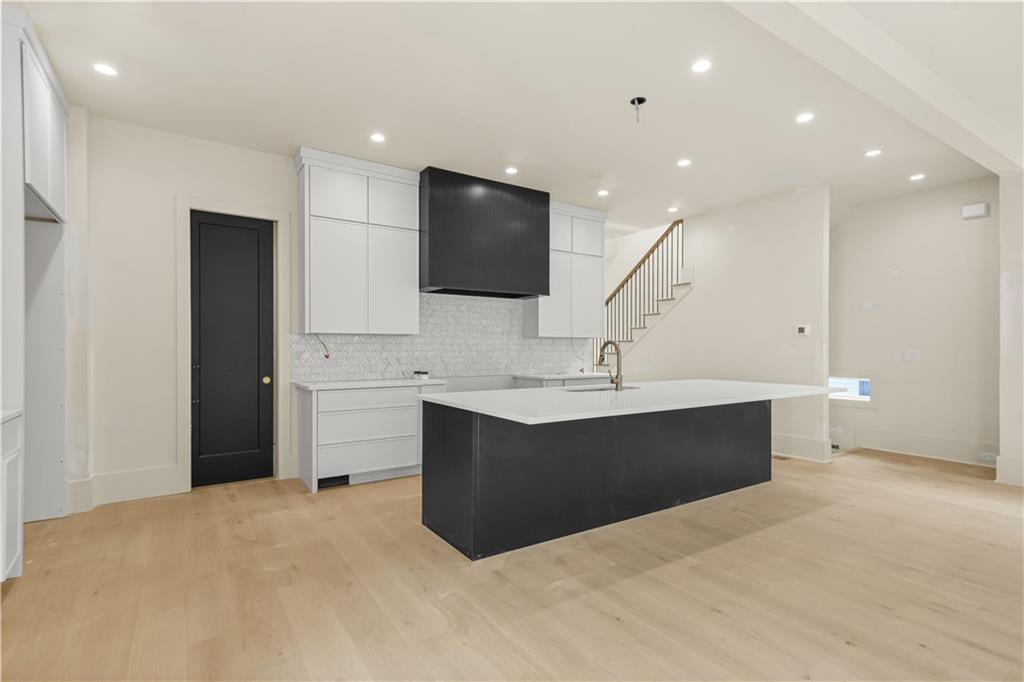 3214 Osborne Road Northeast Atlanta, GA 30319 - Photo 13 of 41 a view of kitchen with a sink cabinet and a living room