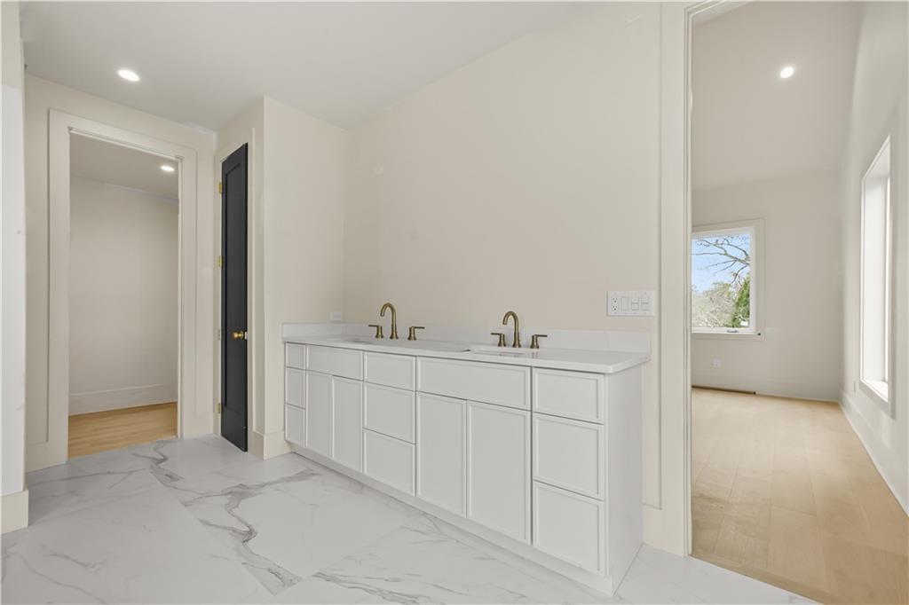 3214 Osborne Road Northeast Atlanta, GA 30319 - Photo 24 of 41 a spacious bathroom with 2 sink and a mirror