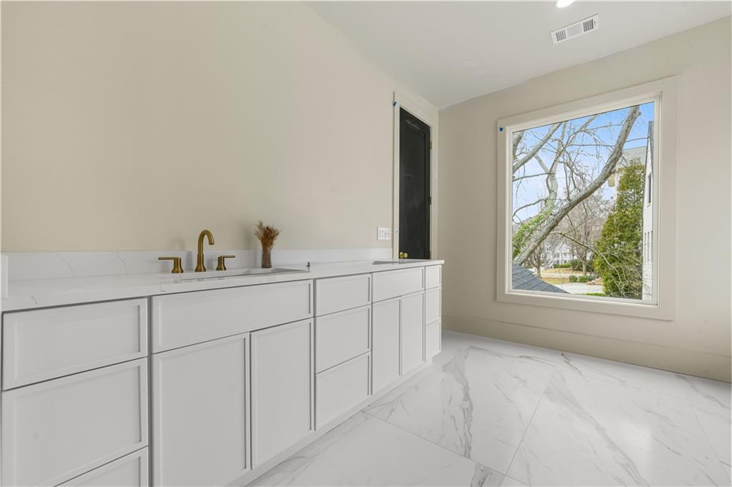 3214 Osborne Road Northeast Atlanta, GA 30319 - Photo 26 of 41 a bathroom with a sink and a mirror