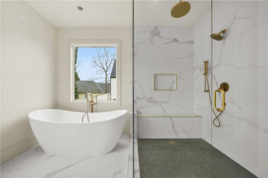 3214 Osborne Road Northeast Atlanta, GA 30319 - Photo 27 of 41 a white tub sitting next to a shower