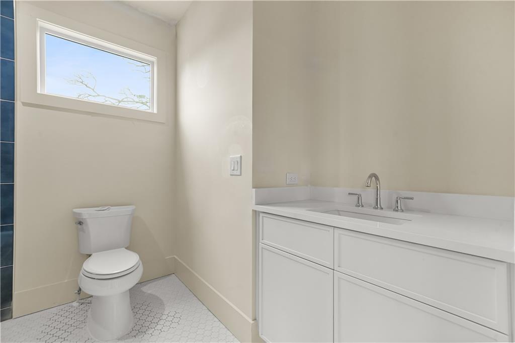 3214 Osborne Road Northeast Atlanta, GA 30319 - Photo 30 of 41 a bathroom with a toilet sink and mirror