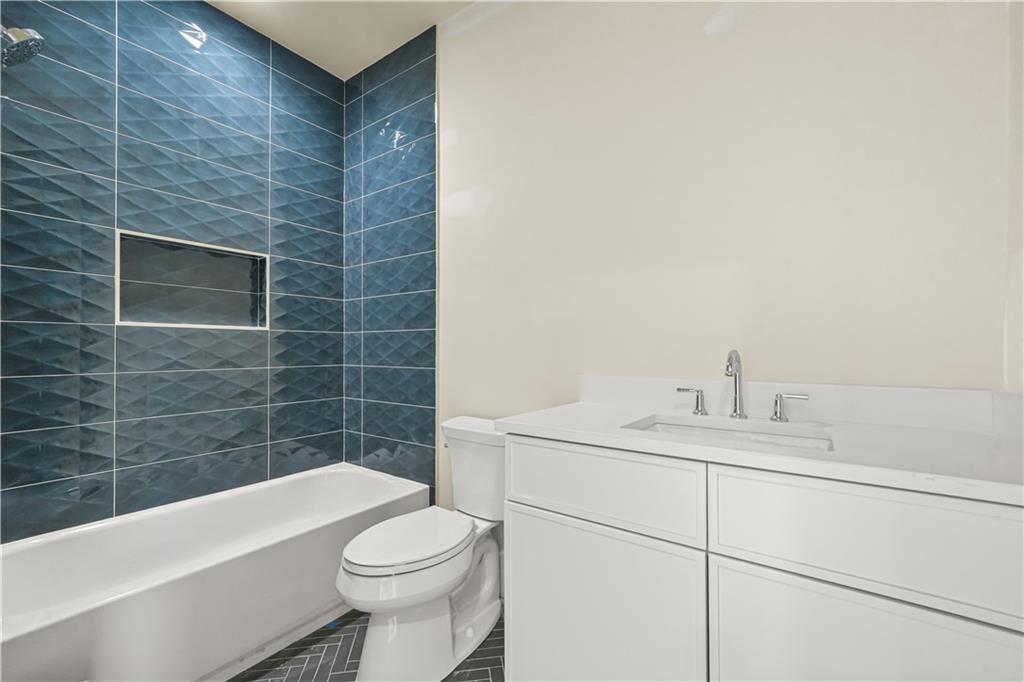 3214 Osborne Road Northeast Atlanta, GA 30319 - Photo 34 of 41 a bathroom with a sink a toilet and bathtub