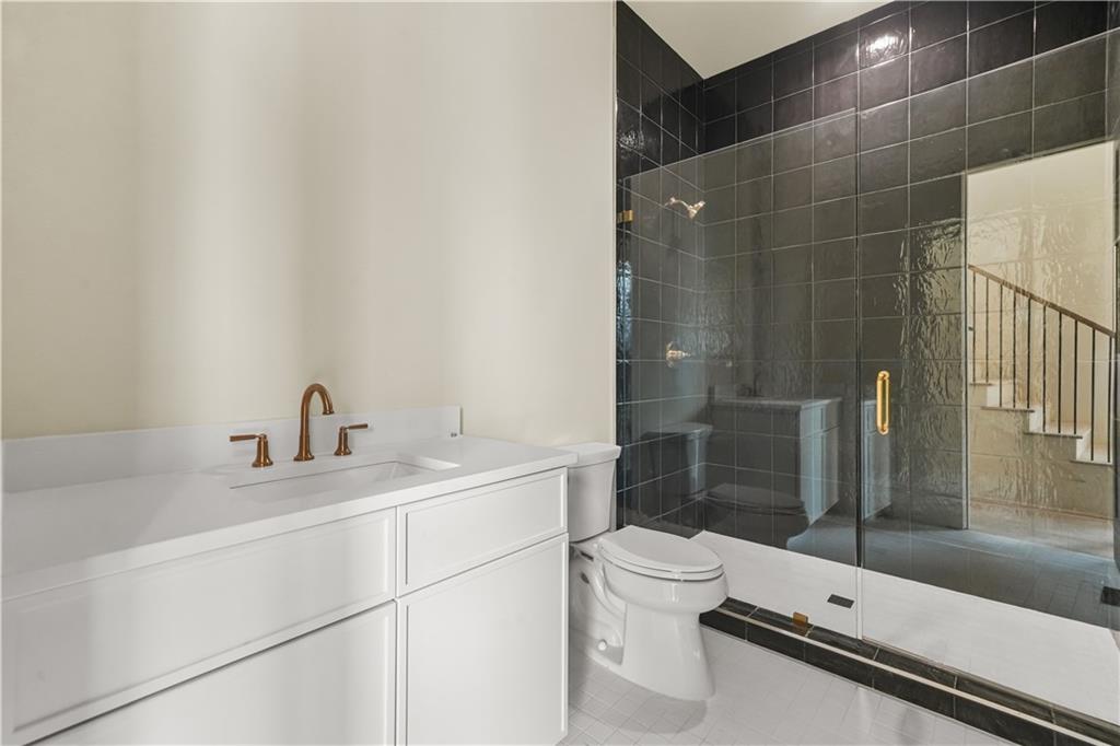 3214 Osborne Road Northeast Atlanta, GA 30319 - Photo 38 of 41 a bathroom with a sink toilet and shower