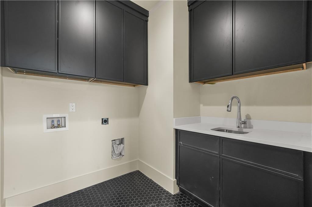 3214 Osborne Road Northeast Atlanta, GA 30319 - Photo 39 of 41 a bathroom with a sink and a mirror