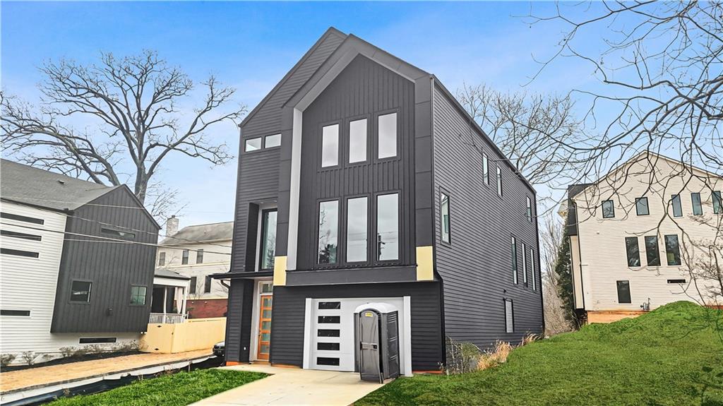 3214 Osborne Road Northeast Atlanta, GA 30319 - Photo 40 of 41 a front view of a house with a yard