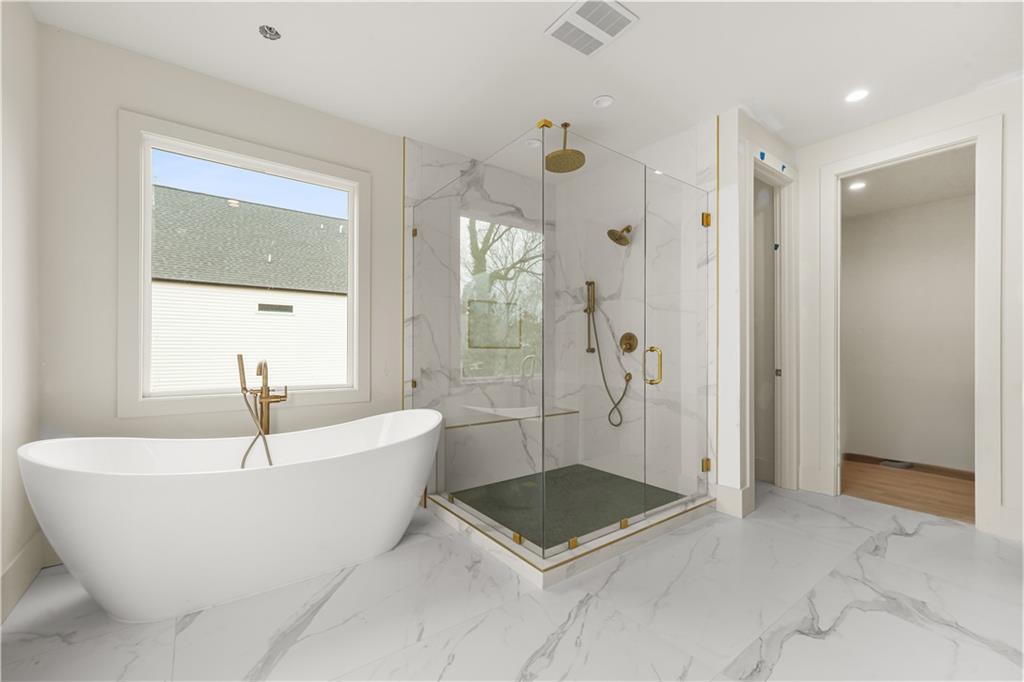 3214 Osborne Road Northeast Atlanta, GA 30319 - Photo 4 of 41 a bathroom with a bathtub and shower