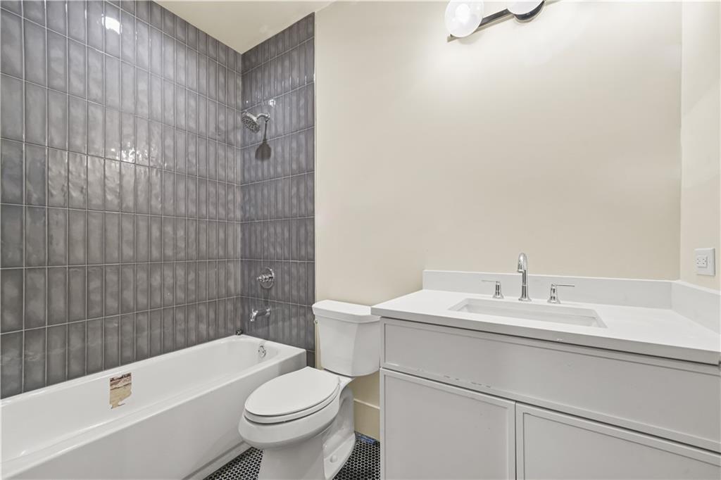 3214 Osborne Road Northeast Atlanta, GA 30319 - Photo 8 of 41 a bathroom with a sink a toilet and shower