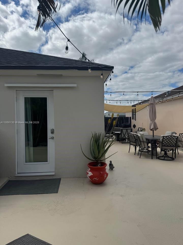 14447 Southwest 152nd Terrace, Unit BACKDOOR Miami, FL 33177 - Photo 9 of 10 a view of a garage with cars