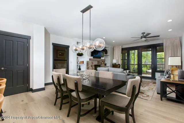 a dining room filled with furniture and window