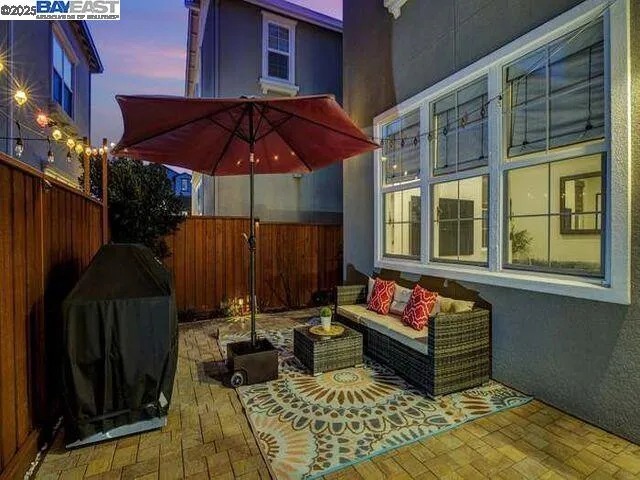 a view of a two chairs in the patio