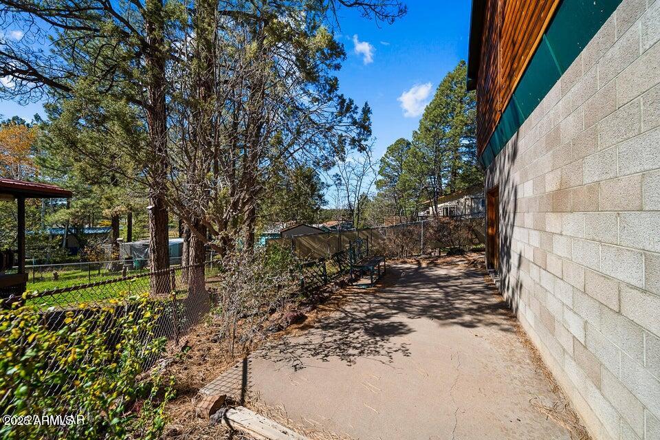 2421 West Thornton Road Show Low, AZ 85901 - Photo 41 of 48 a view of a yard with plants and large trees