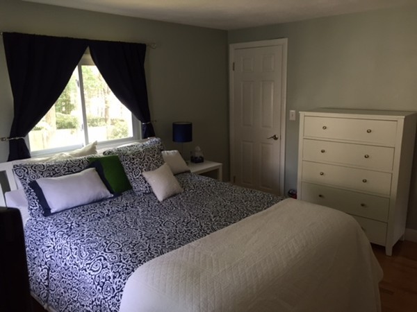 114 Edwardel Road Needham, MA 02492 - Photo 7 of 9 a large bed sitting in a bedroom next to a window