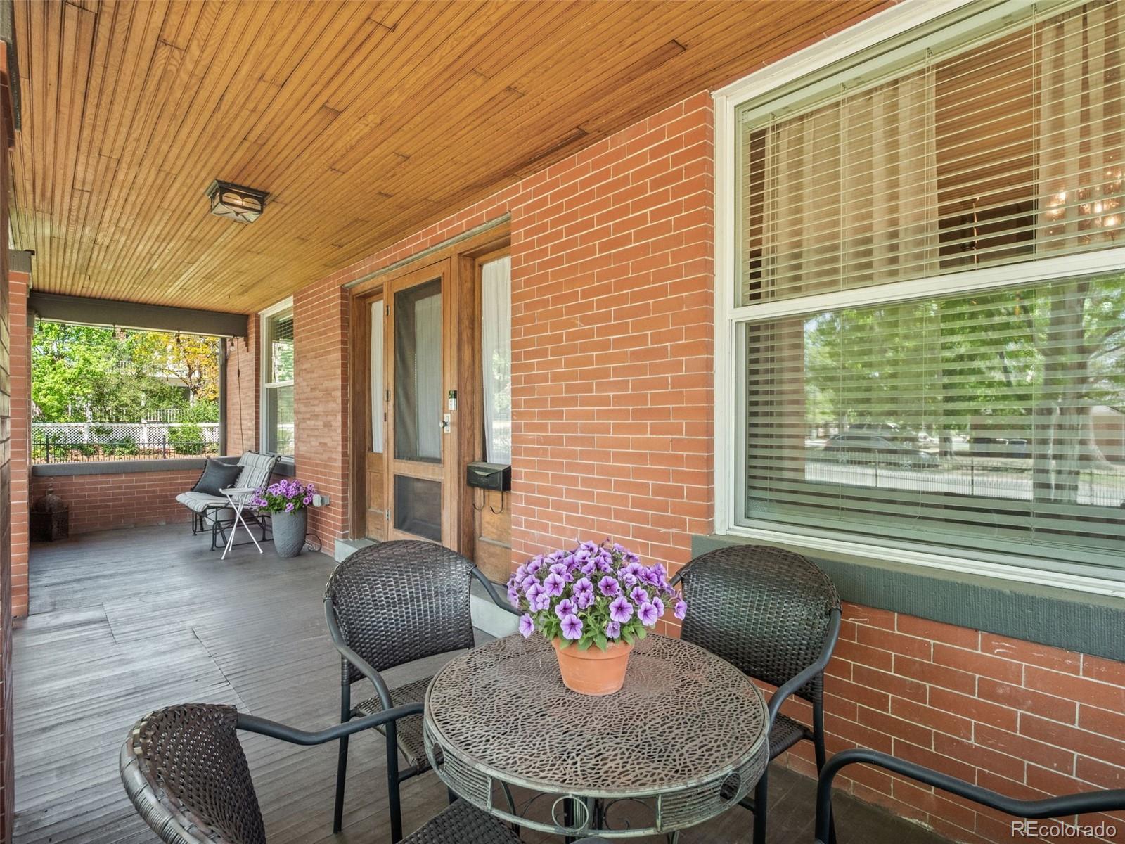 6595 West 46th Place Wheat Ridge, CO 80033 - Photo 4 of 48 a outdoor dining space with furniture and a potted plant