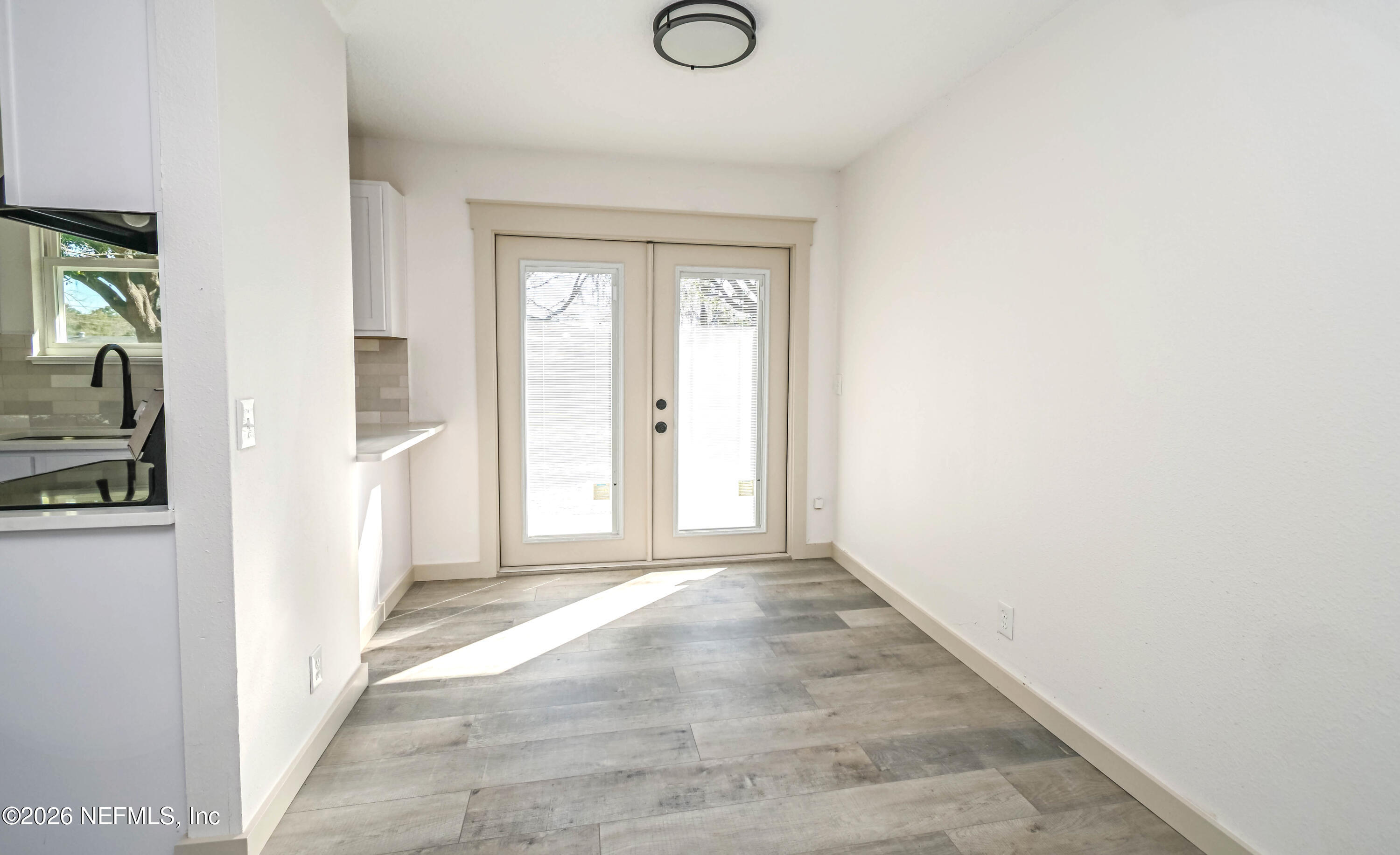 406 Barbara Circle Macclenny, FL 32063 - Photo 11 of 31 a view of a livingroom with wooden floor and a window