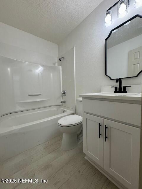 406 Barbara Circle Macclenny, FL 32063 - Photo 17 of 31 a bathroom with a toilet a sink a mirror and a bathtub