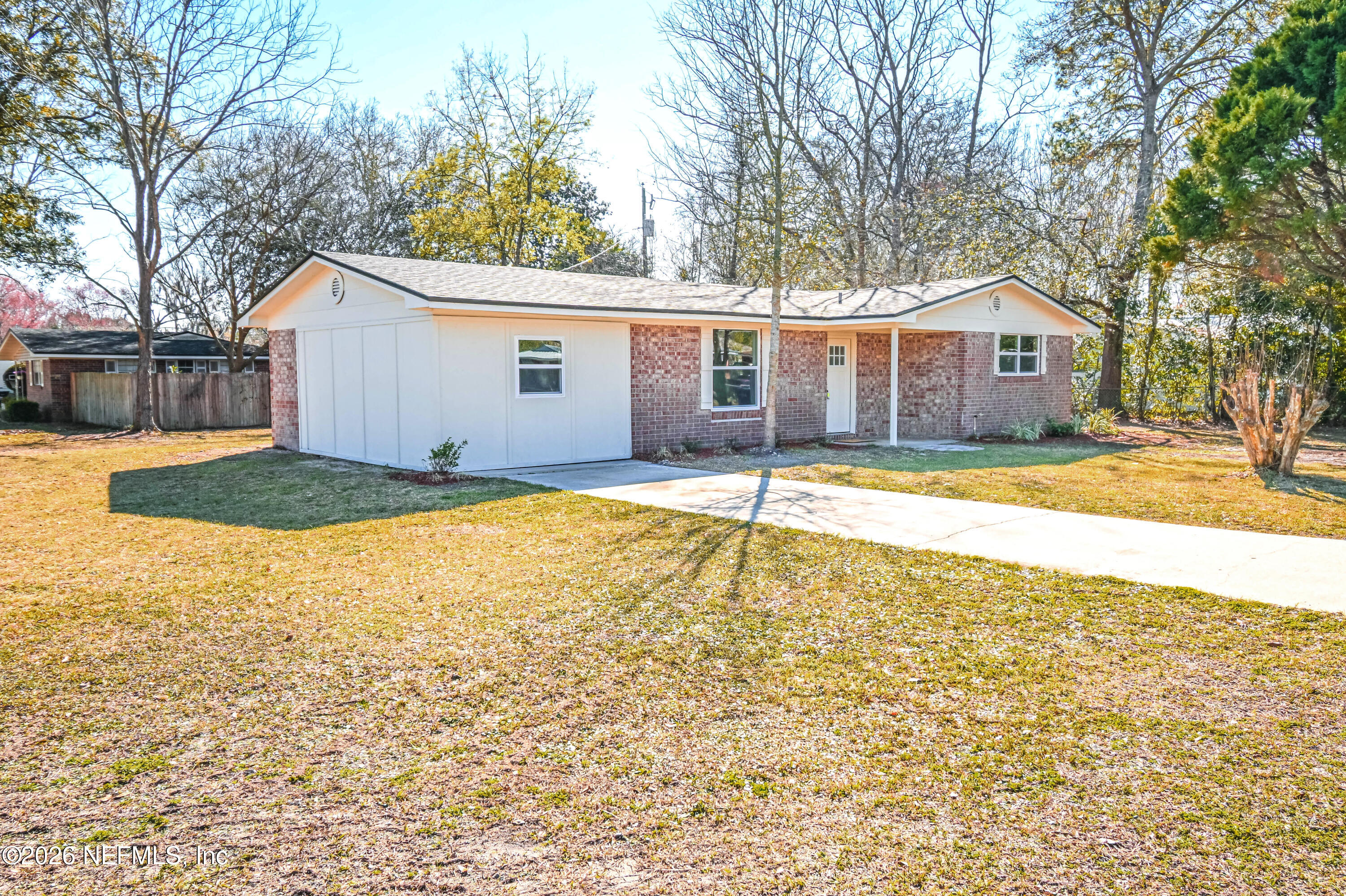 406 Barbara Circle Macclenny, FL 32063 - Photo 2 of 31 a view of a house with a yard and large tree