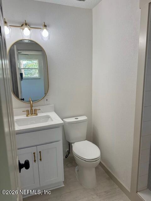 406 Barbara Circle Macclenny, FL 32063 - Photo 23 of 31 a bathroom with a toilet sink and mirror