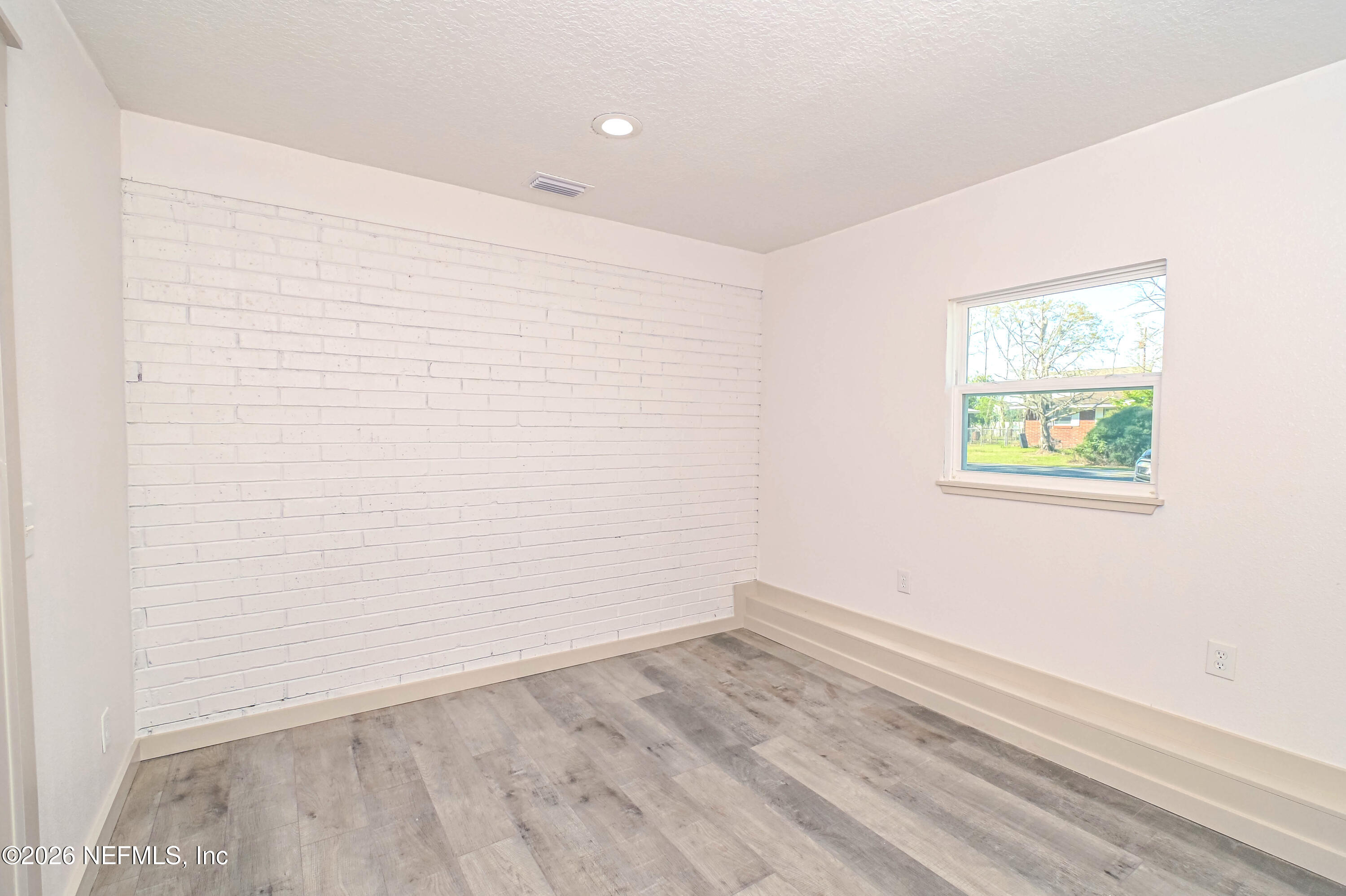 406 Barbara Circle Macclenny, FL 32063 - Photo 25 of 31 an empty room with a window