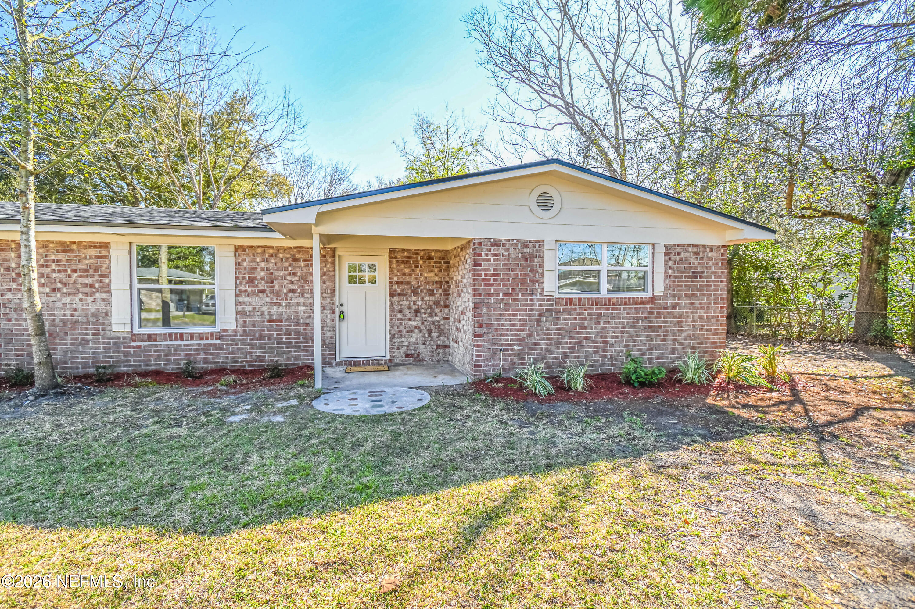 406 Barbara Circle Macclenny, FL 32063 - Photo 3 of 31 a front view of a house with a yard
