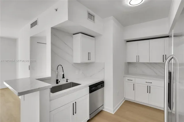 a kitchen with a stove and a microwave