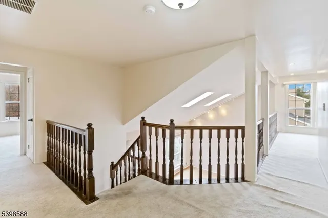 a view of a hallway with windows