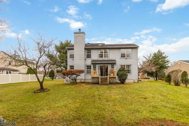 a view of house with outdoor space and swimming pool