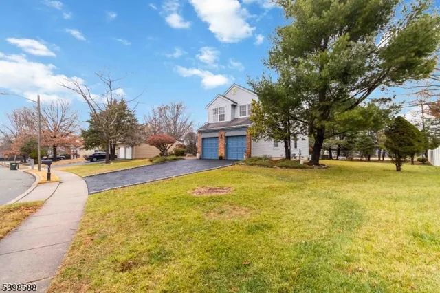 a house view with swimming pool in front of it