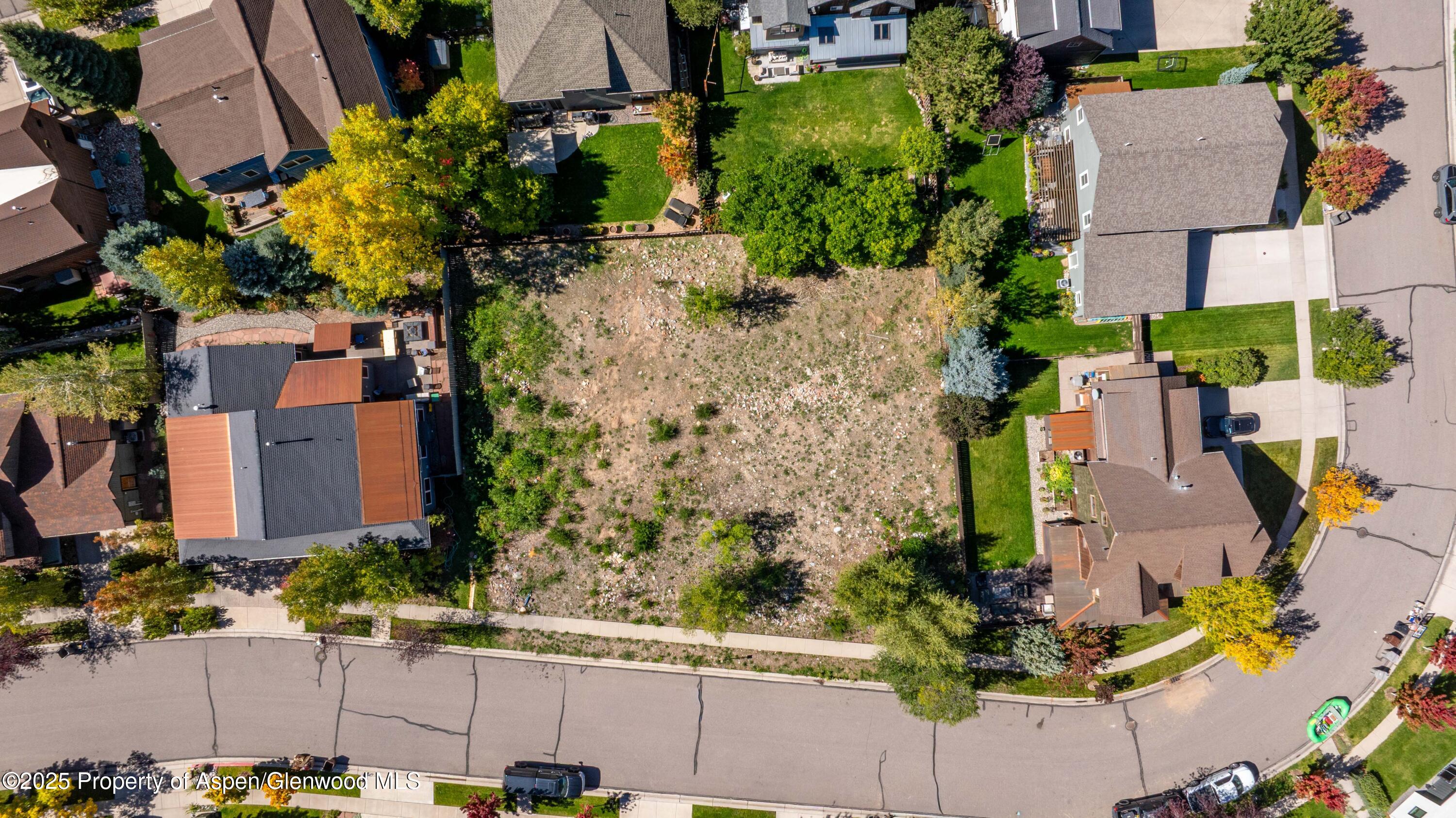 343 Sopris Circle Basalt, CO 81621 - Photo 2 of 5 an aerial view of a house with a yard and large trees