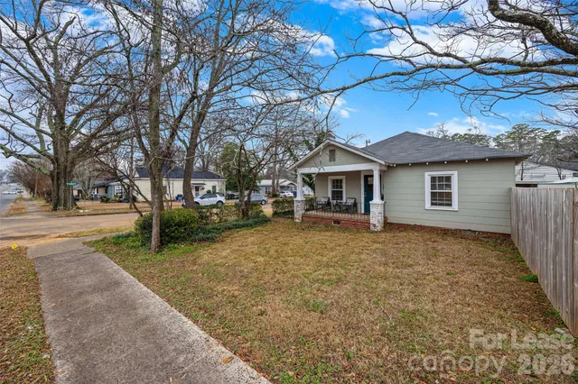a house with trees in the background