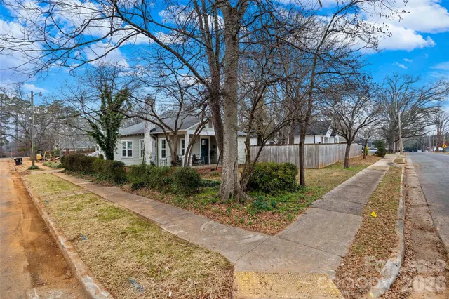 a view of park with large trees