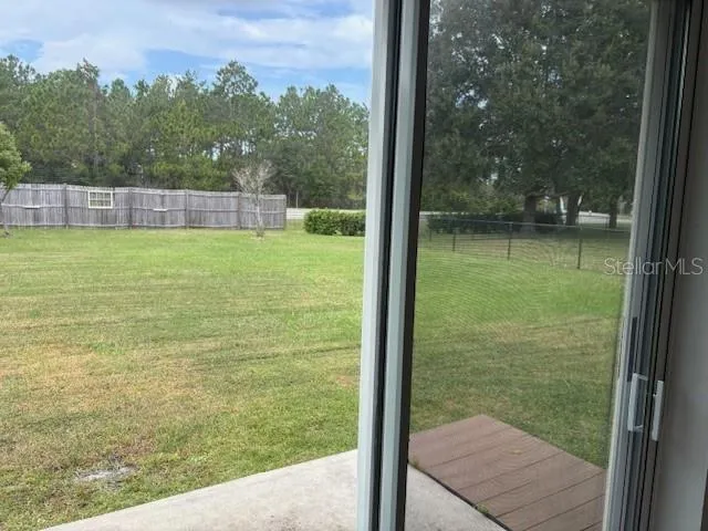 a living room with furniture and a ceiling fan