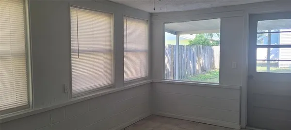 an empty room with windows