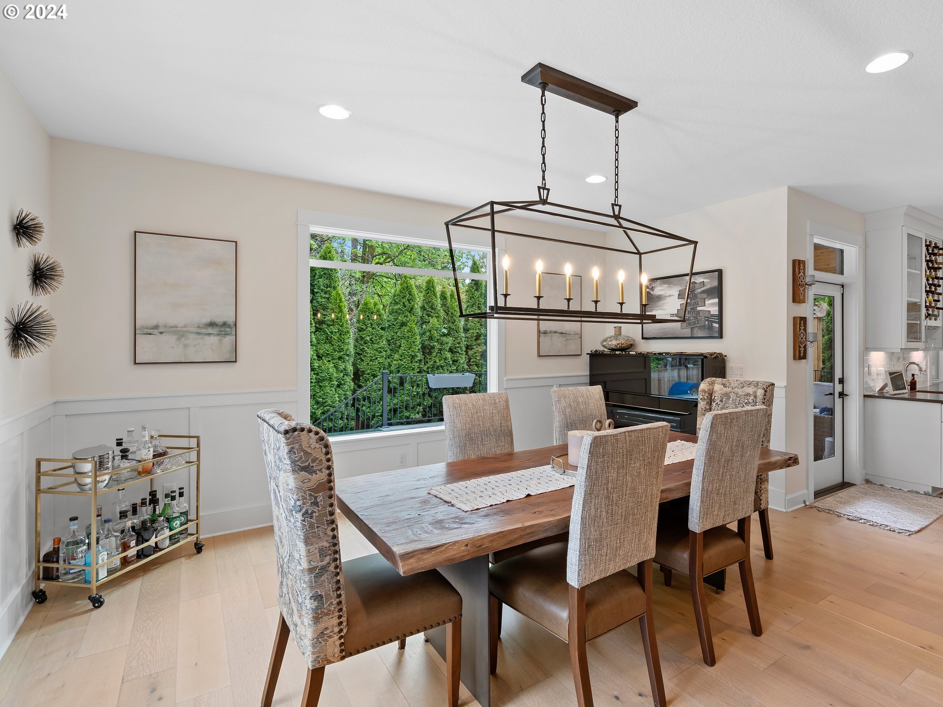 9010 Southwest Inez Street Tigard, OR 97224 - Photo 13 of 42 a view of a dining room with furniture window and wooden floor