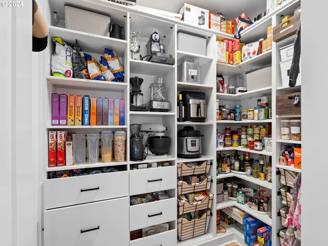 a shelf with books and knick knacks on it